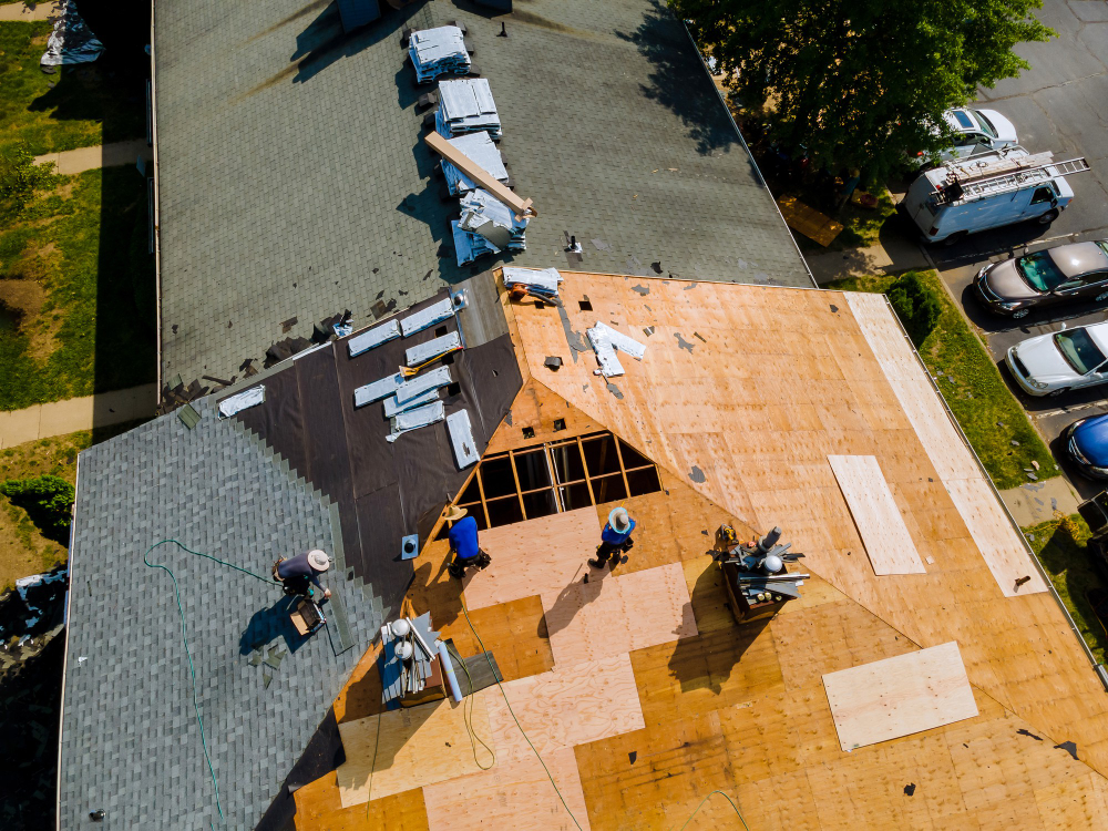 removal-old-roof-replacement-roofs-with-new-roof-shingle-being-applied-home-roof-construction
